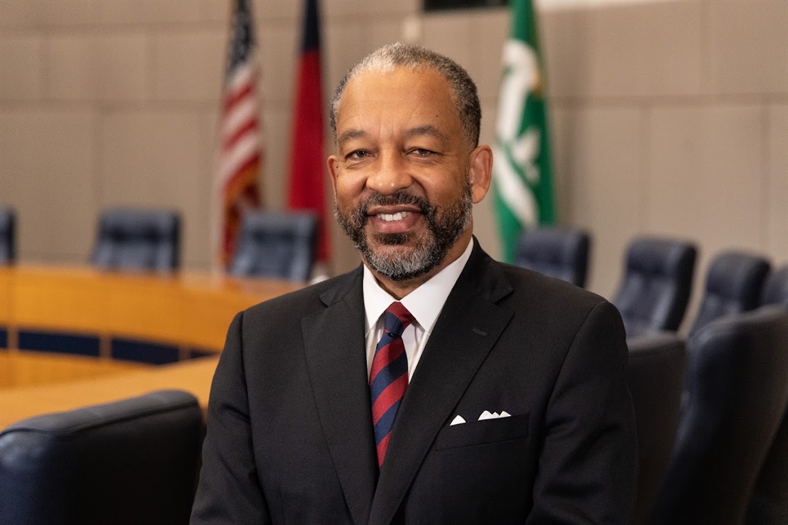 A smiling portrait of Rob Harrington in the Council Chamber