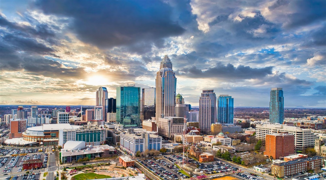 The Charlotte skyline with dark clouds.