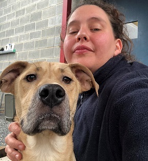 amy yeager poses with a shelter dog