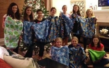 a group of excited kids who donated hand-made blankets for our shelter pets