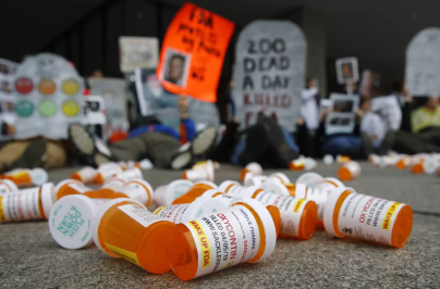 screenshot of many pill bottles on the ground