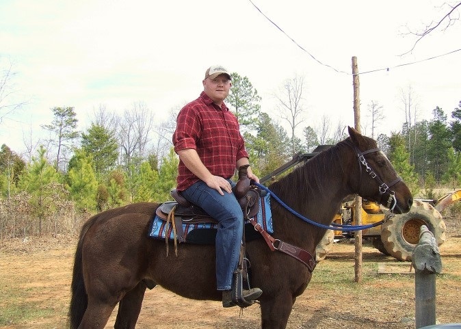a picture of manager bryan harkey on his horse