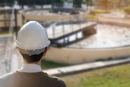 Man with a hard hat at a water plant