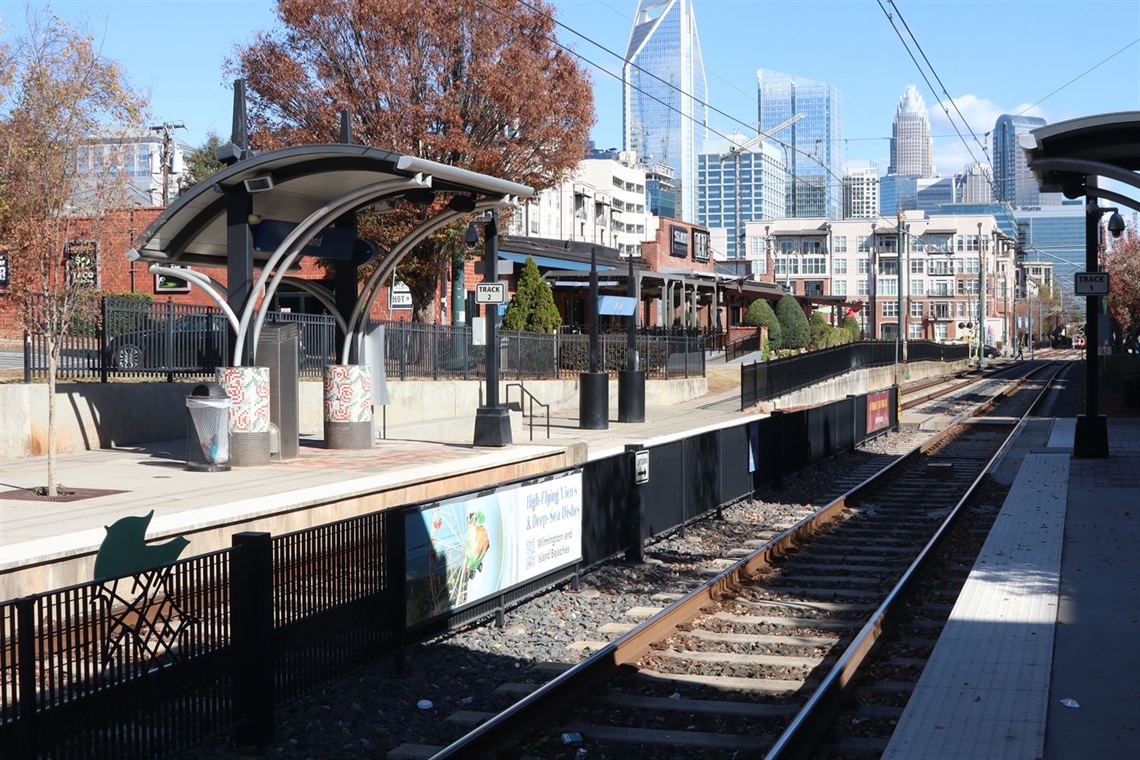CATS rail station at track number two with the Charlotte skyline in the background