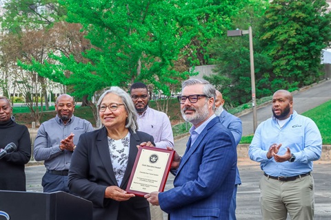 TSA and CATS Staff holding Award in Marshall Park