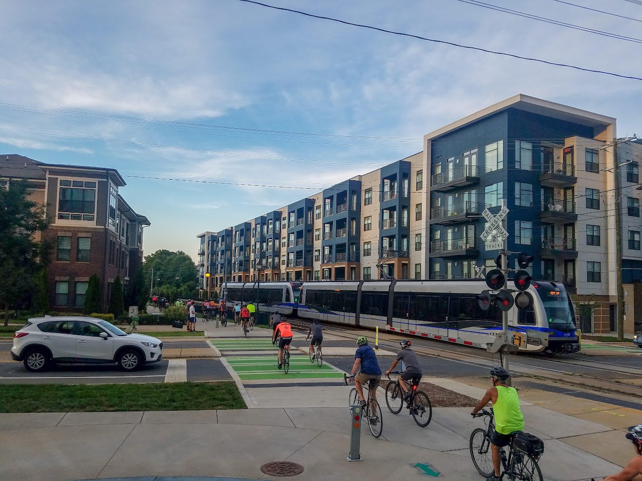 people riding bikes crossing the street