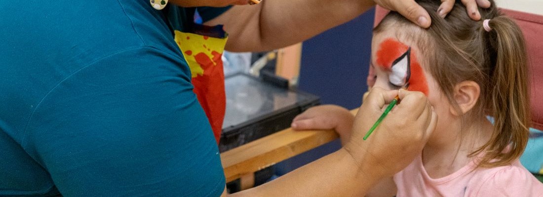 Face painting at Arrowood SIA Community event.