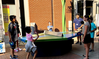 Events Activities 2 children playing Ping Pong