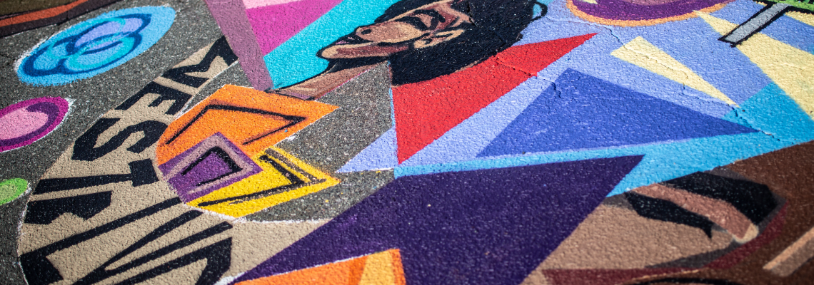 close-up of a brightly painted street in West Charlotte