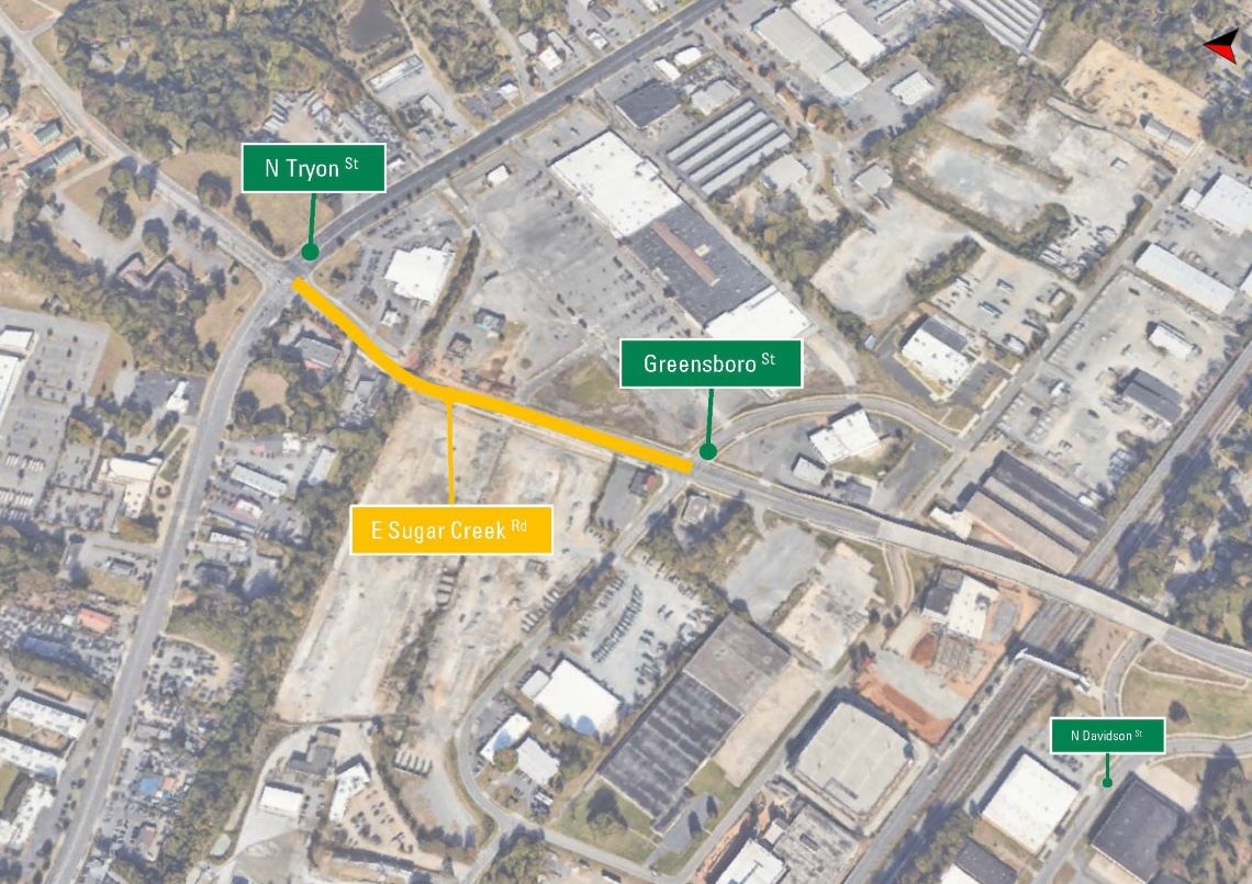 An aerial view of the project area, with a yellow line depicting the alignment of the streetscape project along East Sugar Creek Rd between N. Tryon and Greensboro St.