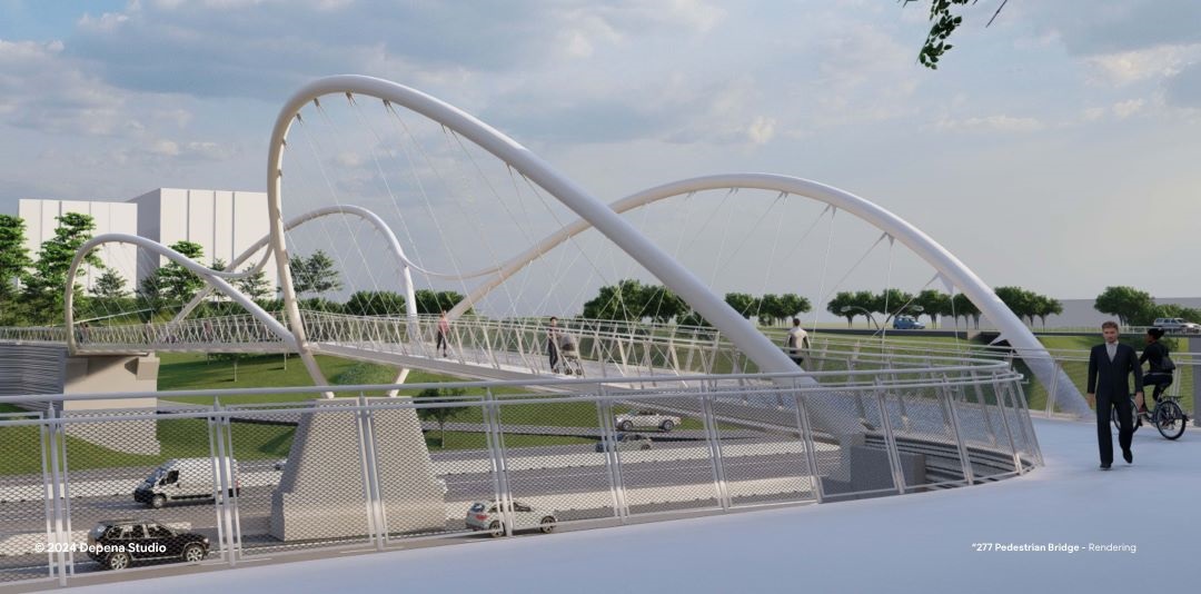 view at bridge level from a distance, with large undulating spans on either side of the bridge and people coming off the approach, with the road underneath