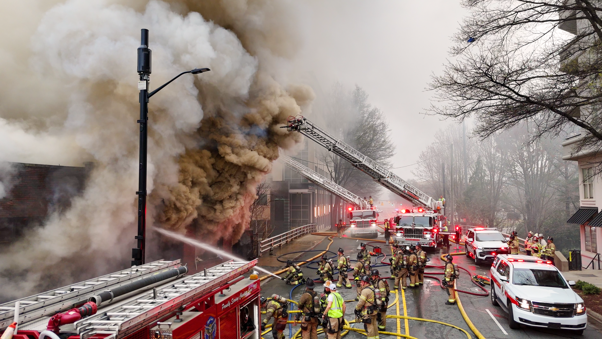 Firefighters deploy multiple lines to contain the March 2025 East Morehead Street fire.