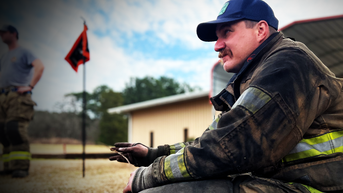 Captain Alex Gordon sits with recruits, offering wisdom and guidance as they prepare to enter the fire service.