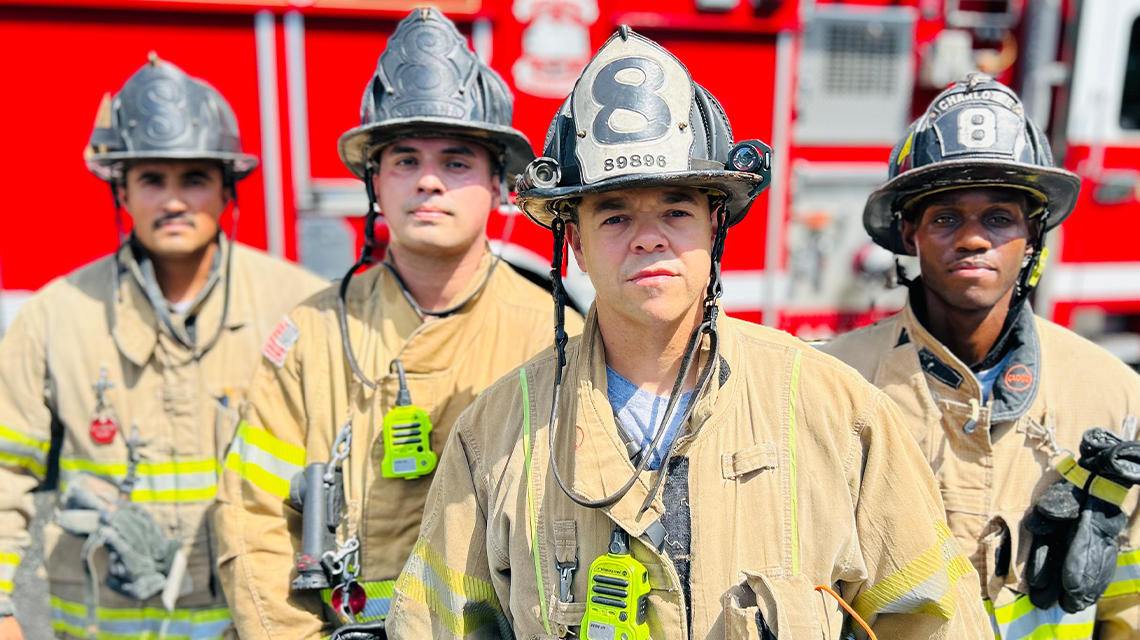 Captain Perez stands with members of his crew outside Engine 8.