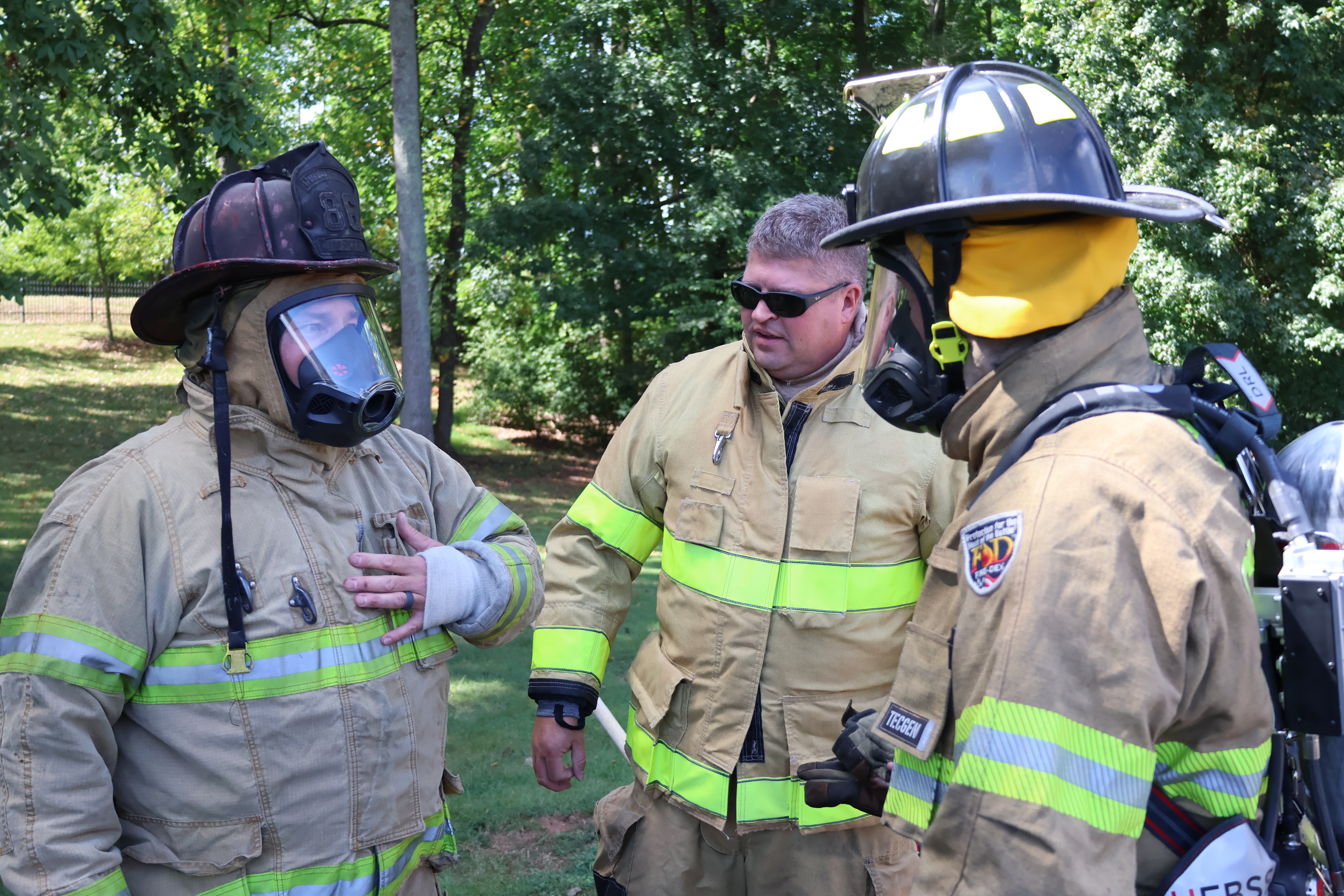 John Bull works with fellow Charlotte Fire investigators during training.