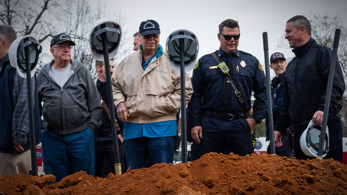Retired and current Charlotte firefighters gather at the site of the new Firehouse 11—honoring the past while building the future together.