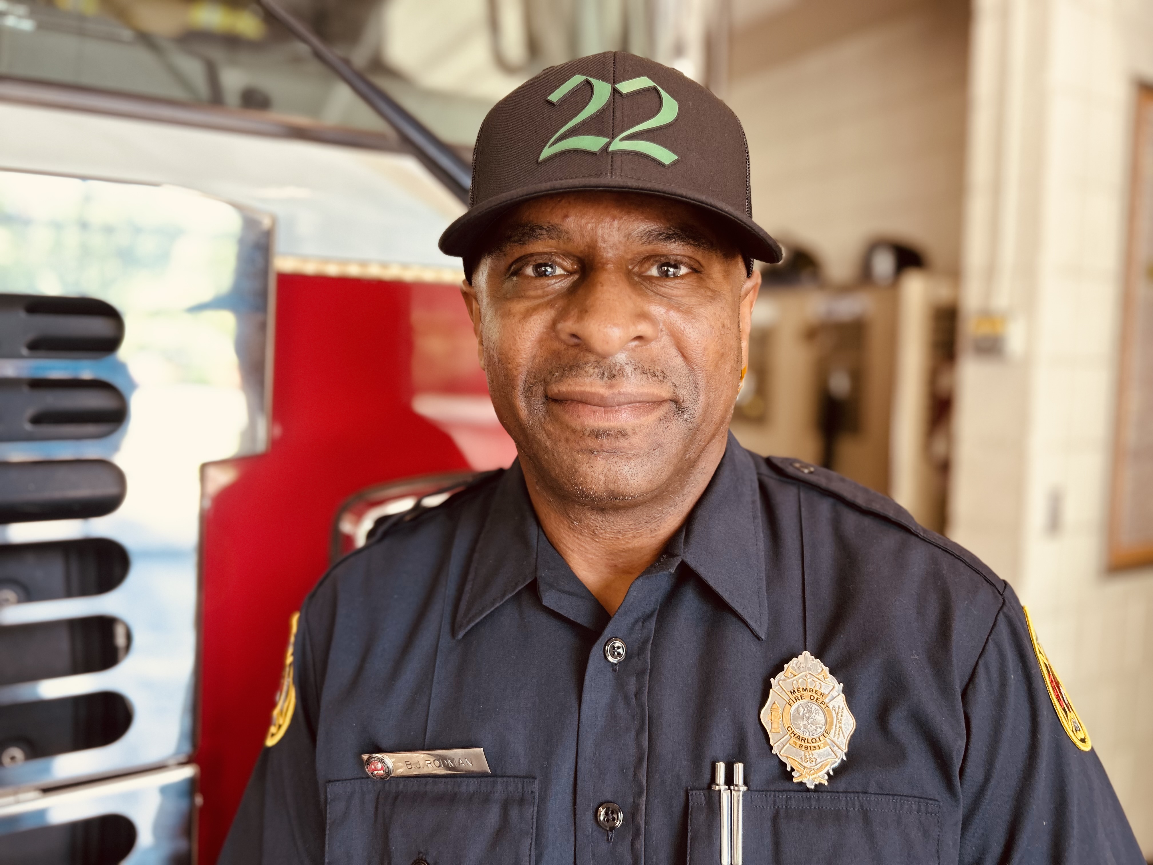 Rodman in front of Engine 22, where returning to work became both a goal and a source of strength throughout his treatment. 