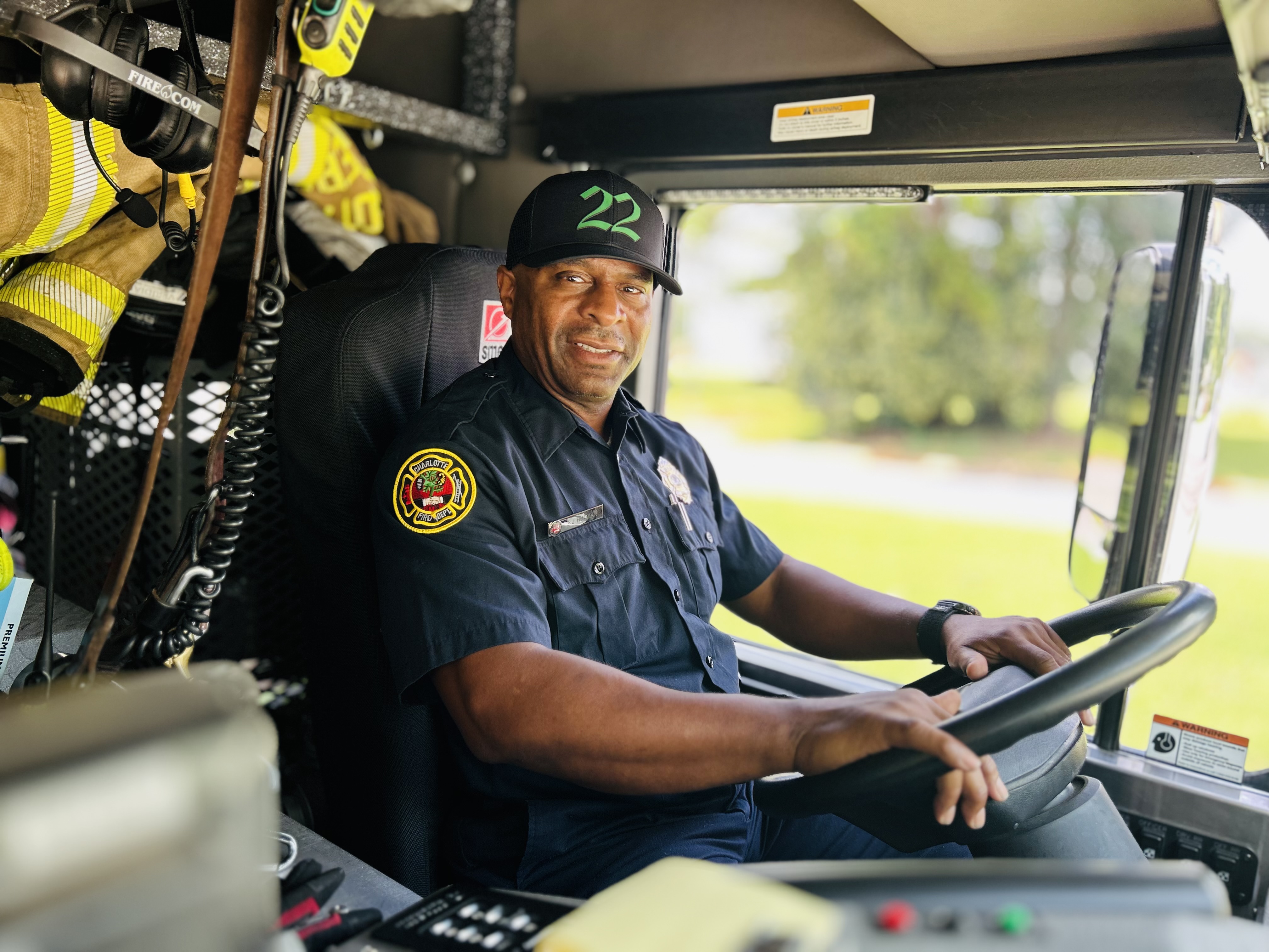 Rodman behind the wheel of Engine 22, finding strength in staying connected to the work and the people who supported him.