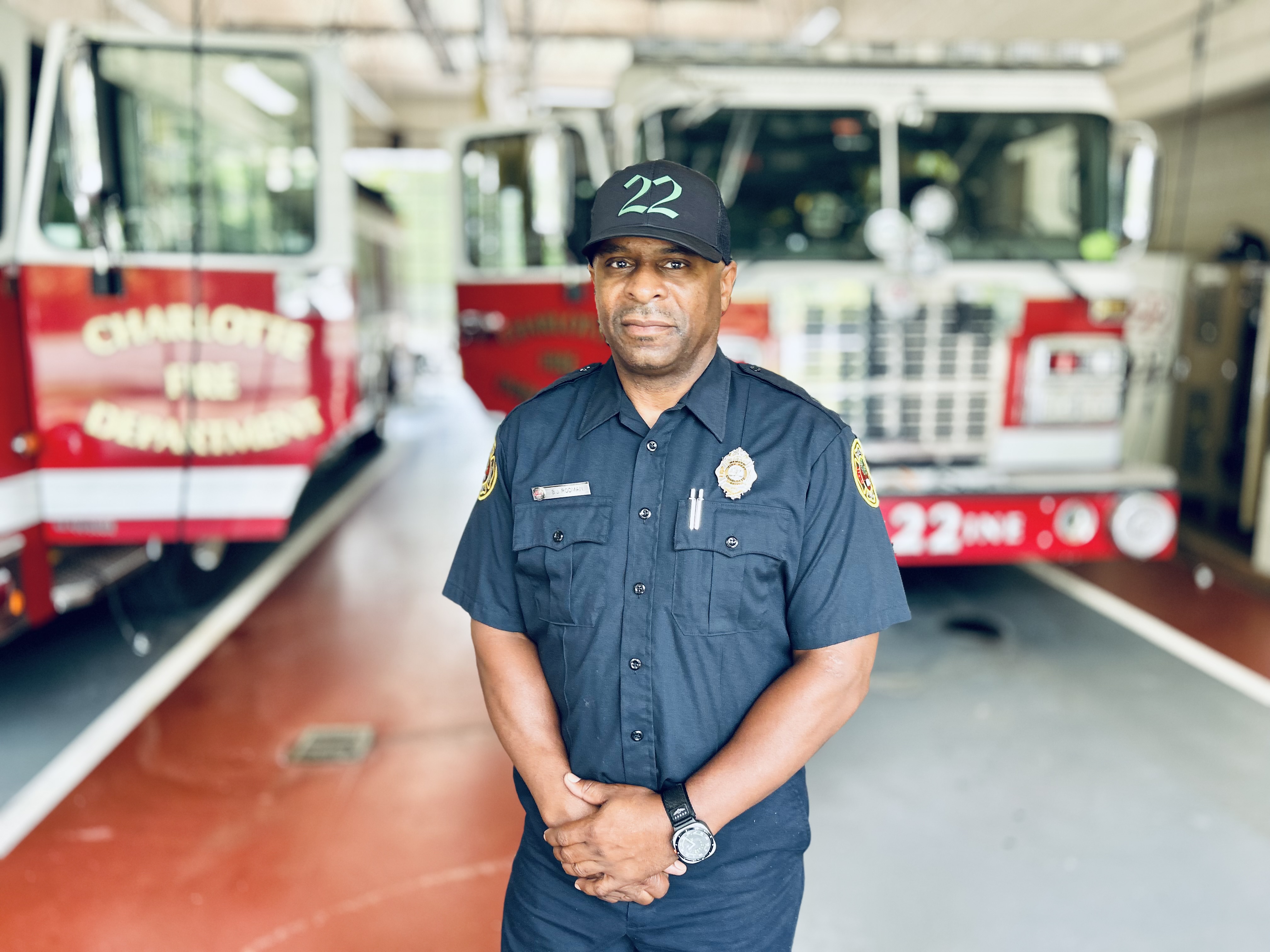 Standing In Bay Rodman standing in the bay of Firehouse 22, where each return to work marked progress in his fight against cancer. 