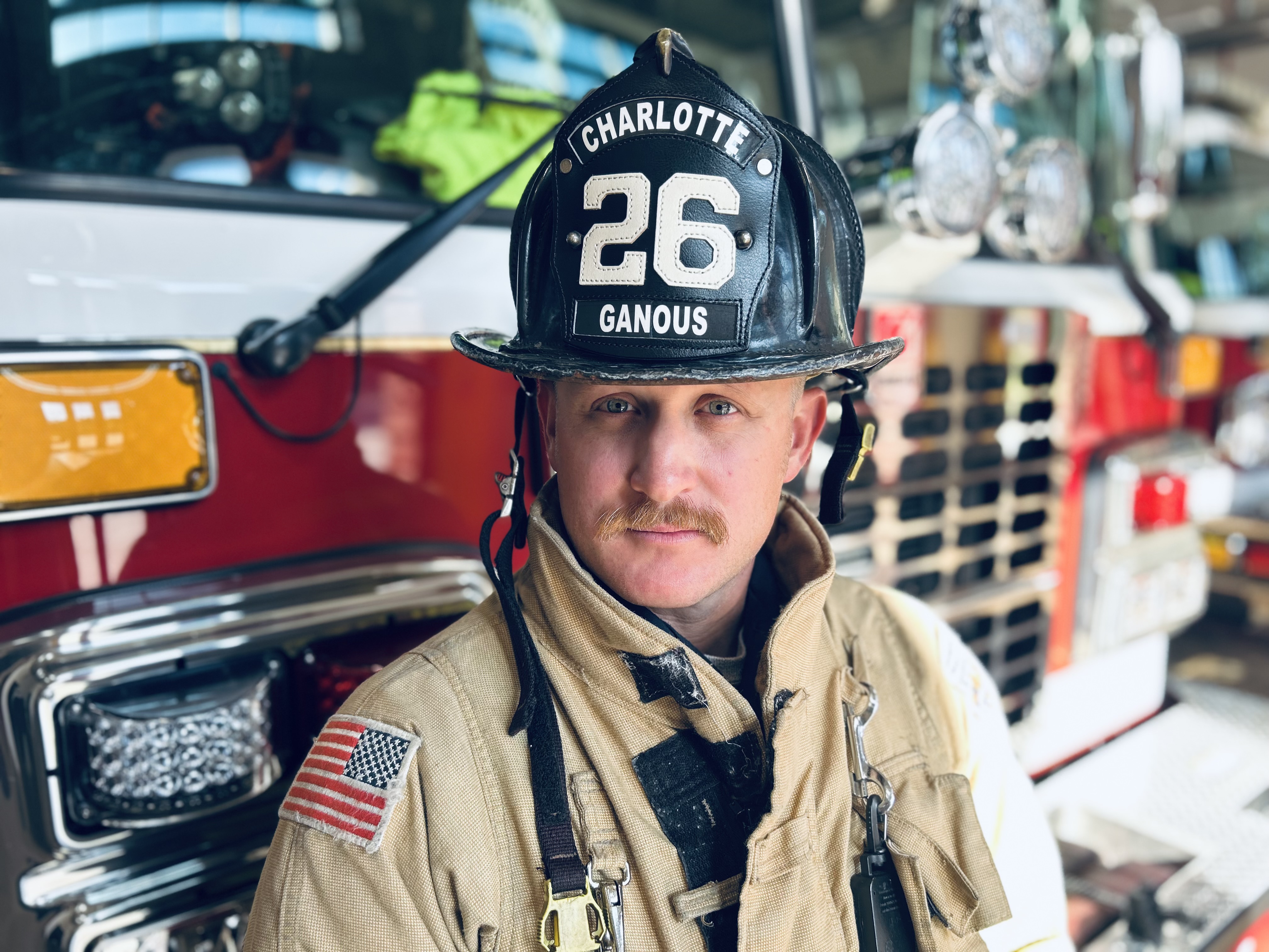 Ganous stands beside apparatus while carrying forward the values of family, faith and service.
