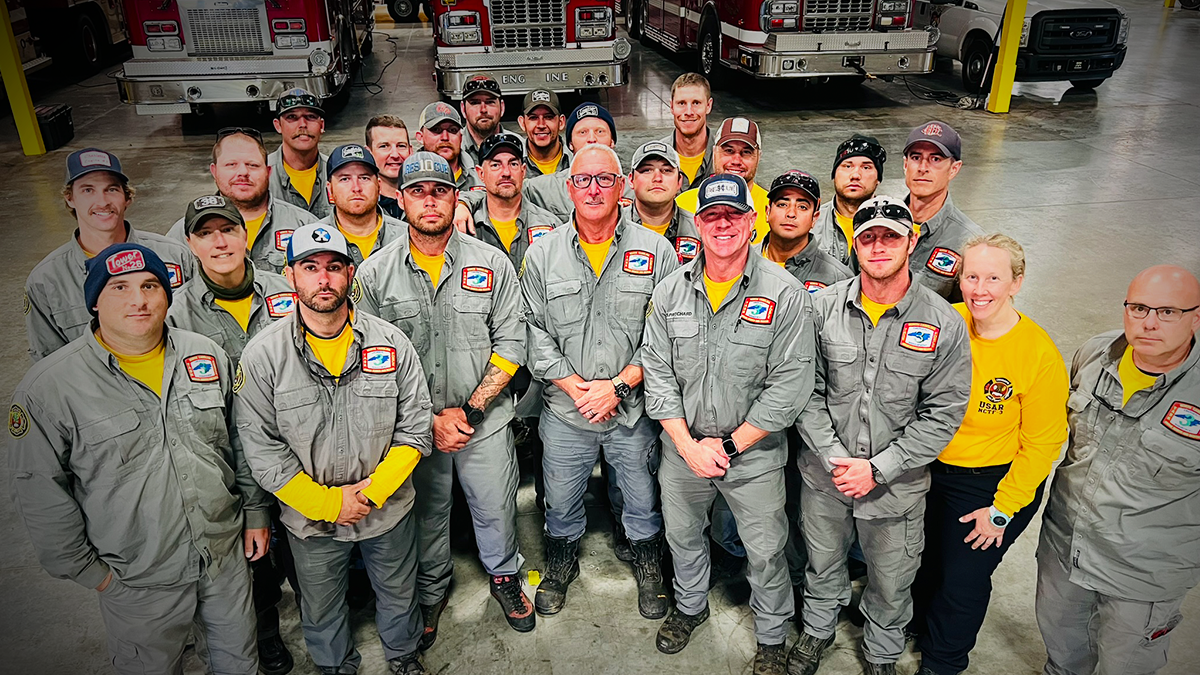 Charlotte Fire Task Force 3 team stands together after their return from Yancey County, where they worked closely with local and federal teams on critical recovery missions.