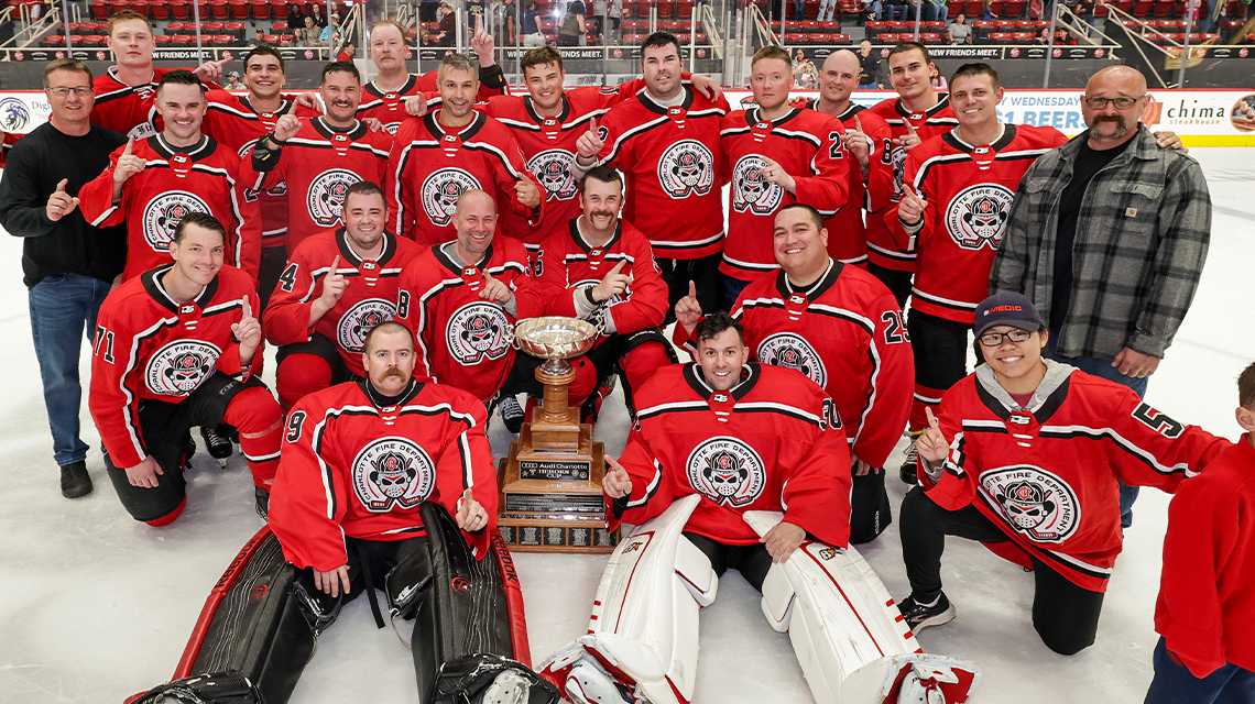 The Charlotte Fire Hockey Team celebrates a hard-earned victory