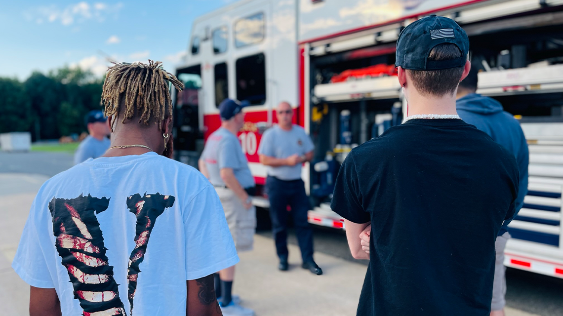 Citizen Fire Academy participants take a closer look at equipment used during high-risk responses, part of a week dedicated to tools, tactics, and teamwork. 