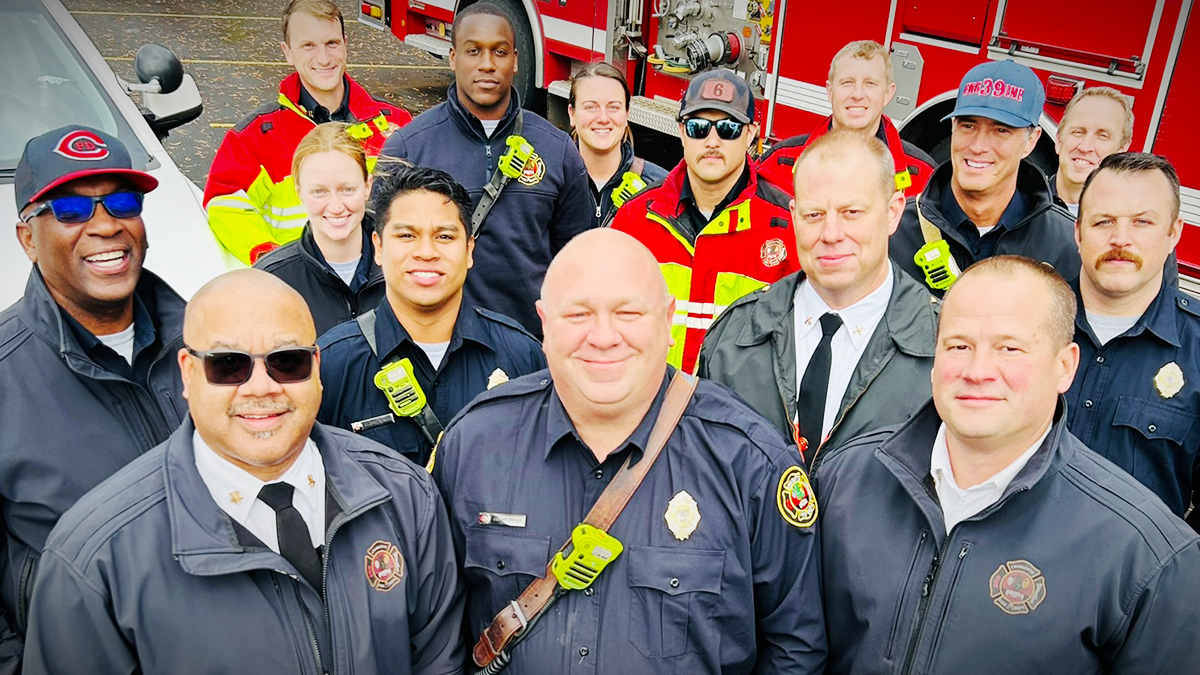 Firefighters from Charlotte Fire gather to help load donated coats onto vehicles for delivery to Crisis Assistance Ministry, ensuring families stay warm this winter.