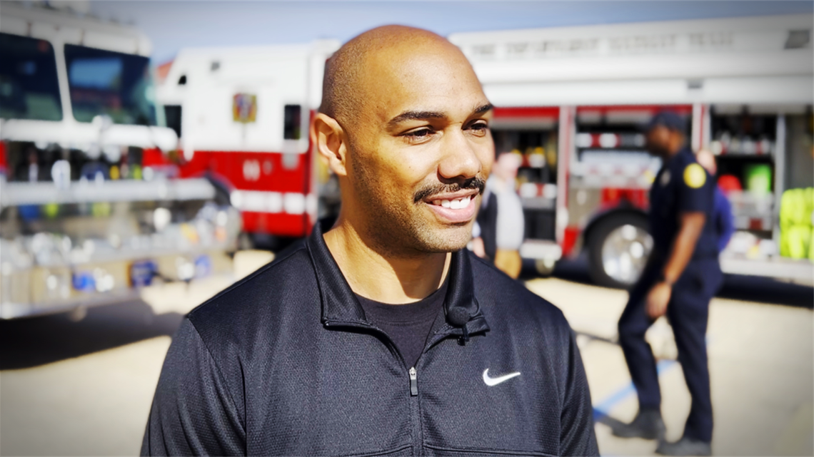 Damon Yates shares his story at the Charlotte Fire Training Academy open house, where he took another step toward his dream of becoming a firefighter, inspired by those who once saved his life.