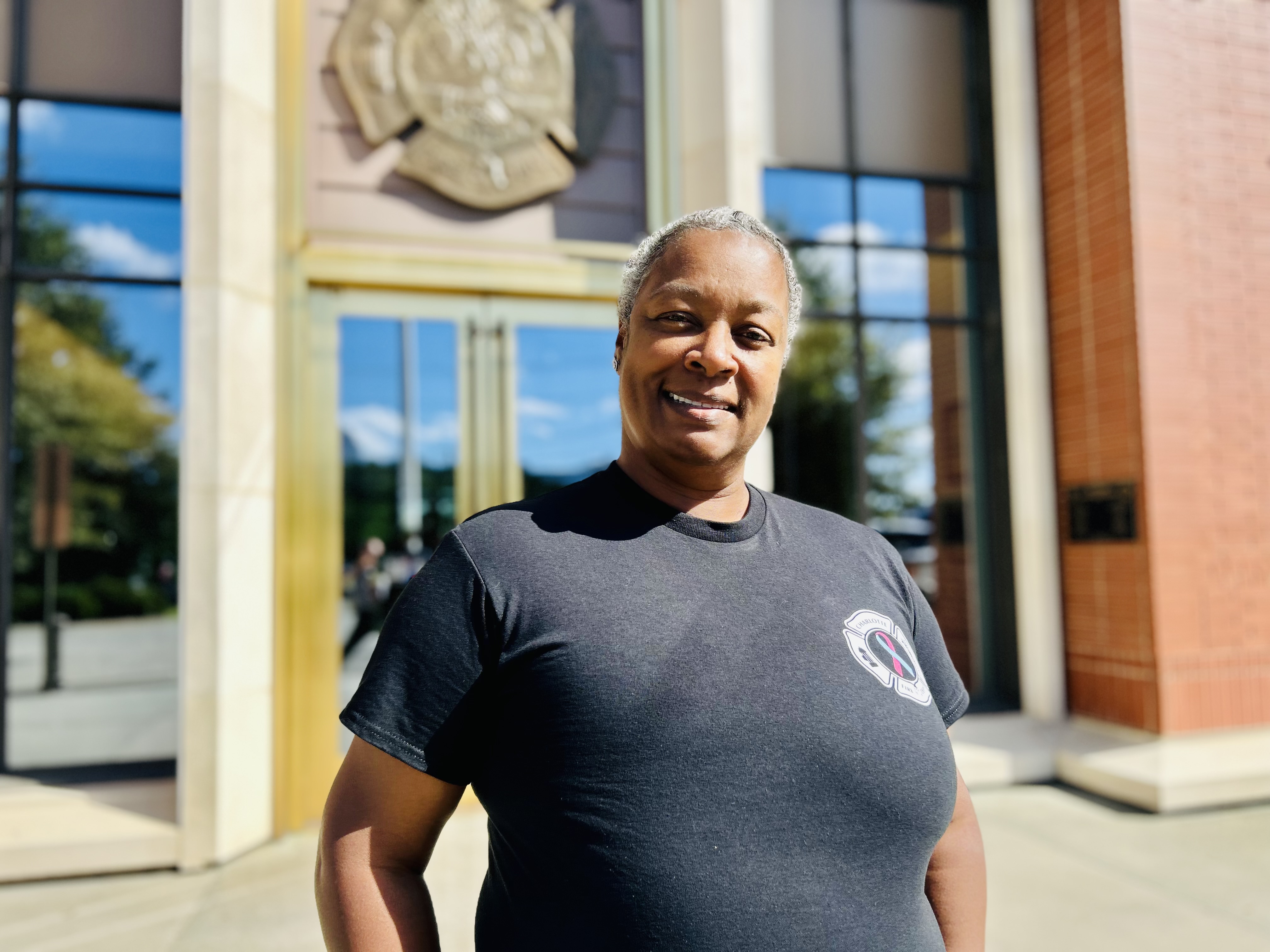 A quiet moment outside Headquarters for Reynolds, whose story of survival and faith continues to inspire across Charlotte Fire. 