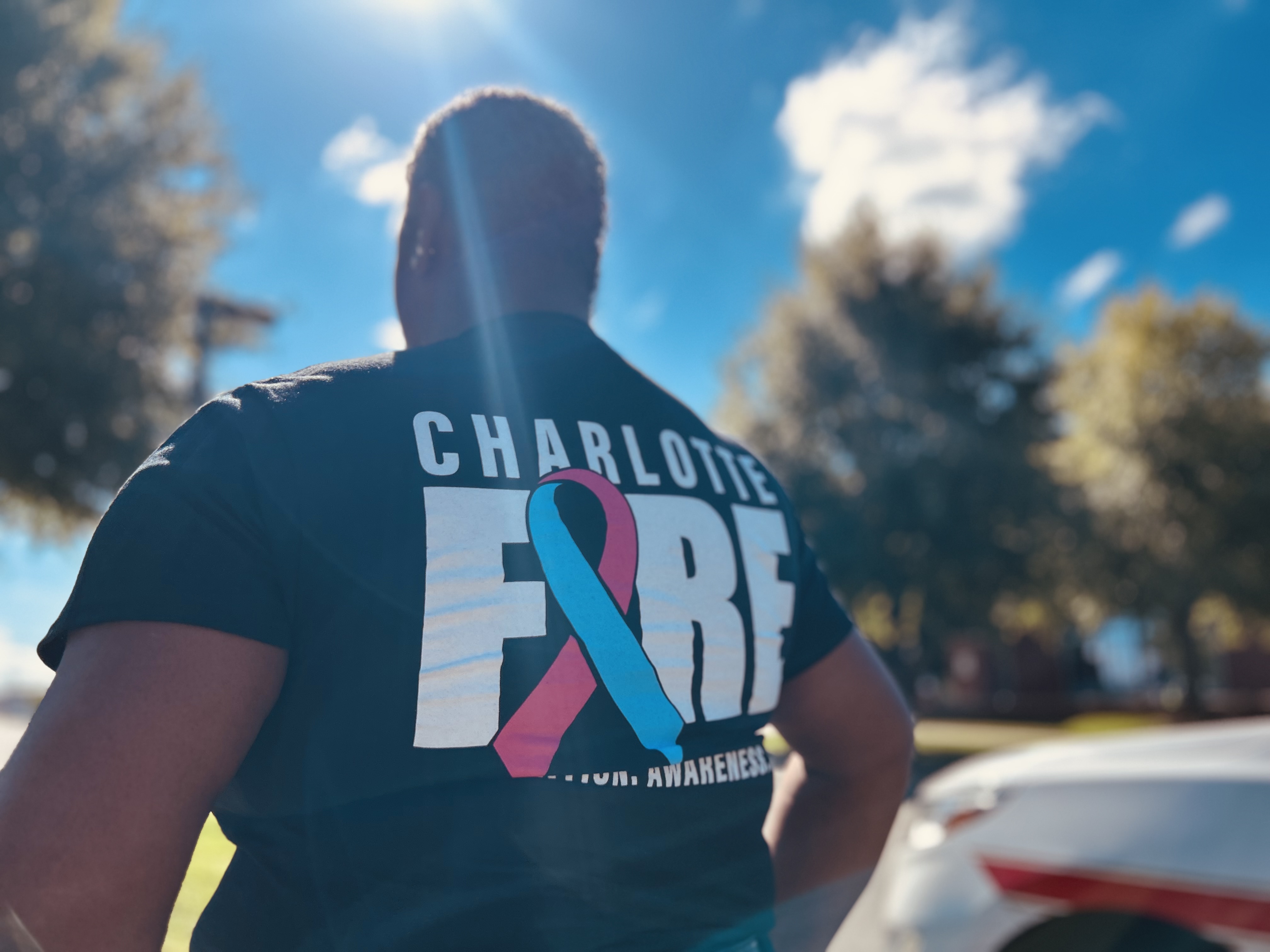 Charlotte Fire shows its support during Breast Cancer Awareness Month, with Inspector Denise Reynolds wearing the department’s awareness shirt that symbolizes her own fight against cancer.