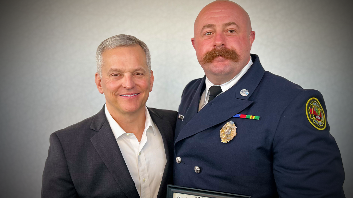 Governor Josh Stein presents Firefighter William Costello with The Order of the Long Leaf Pine, recognizing his courage and commitment during one of Charlotte’s darkest days.