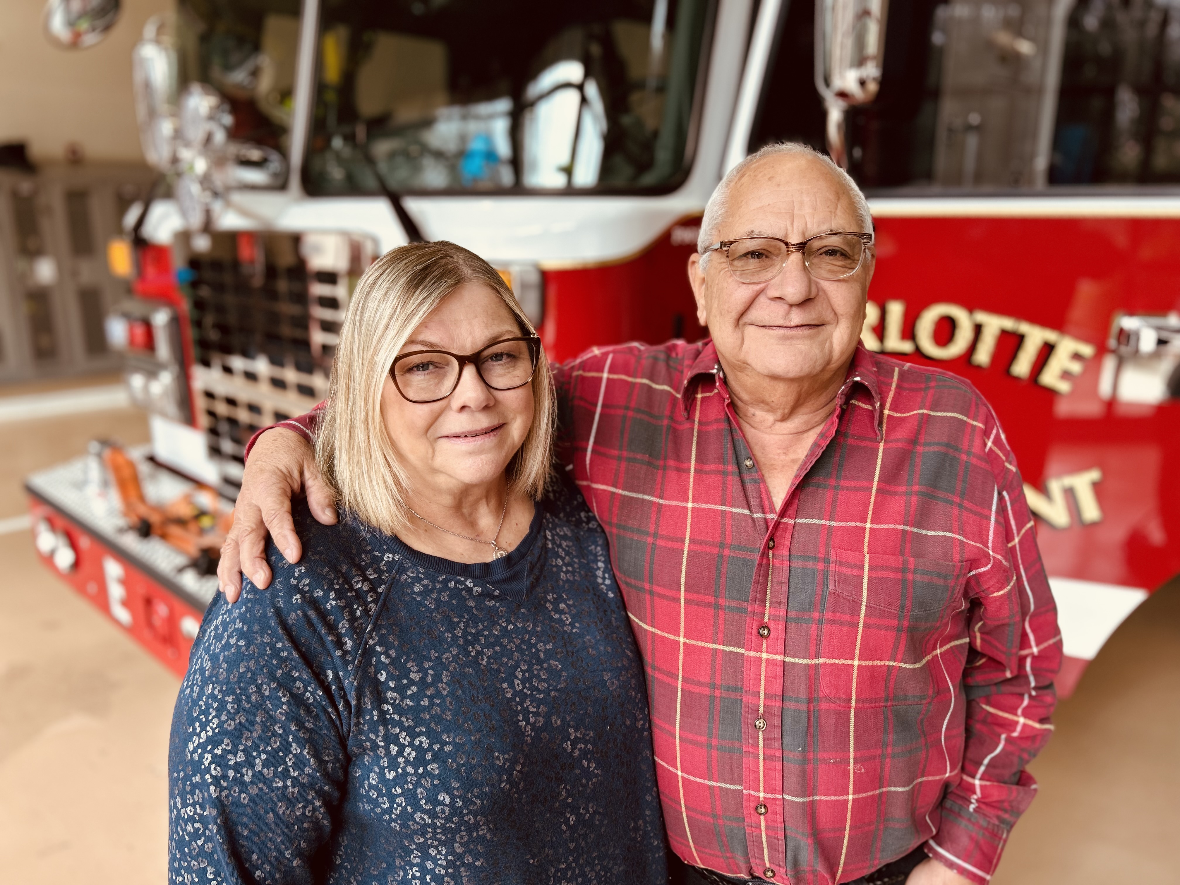 Darlene and her husband, Joey, share a quiet moment outside Engine 38 during their visit with the firefighters who answered the call.