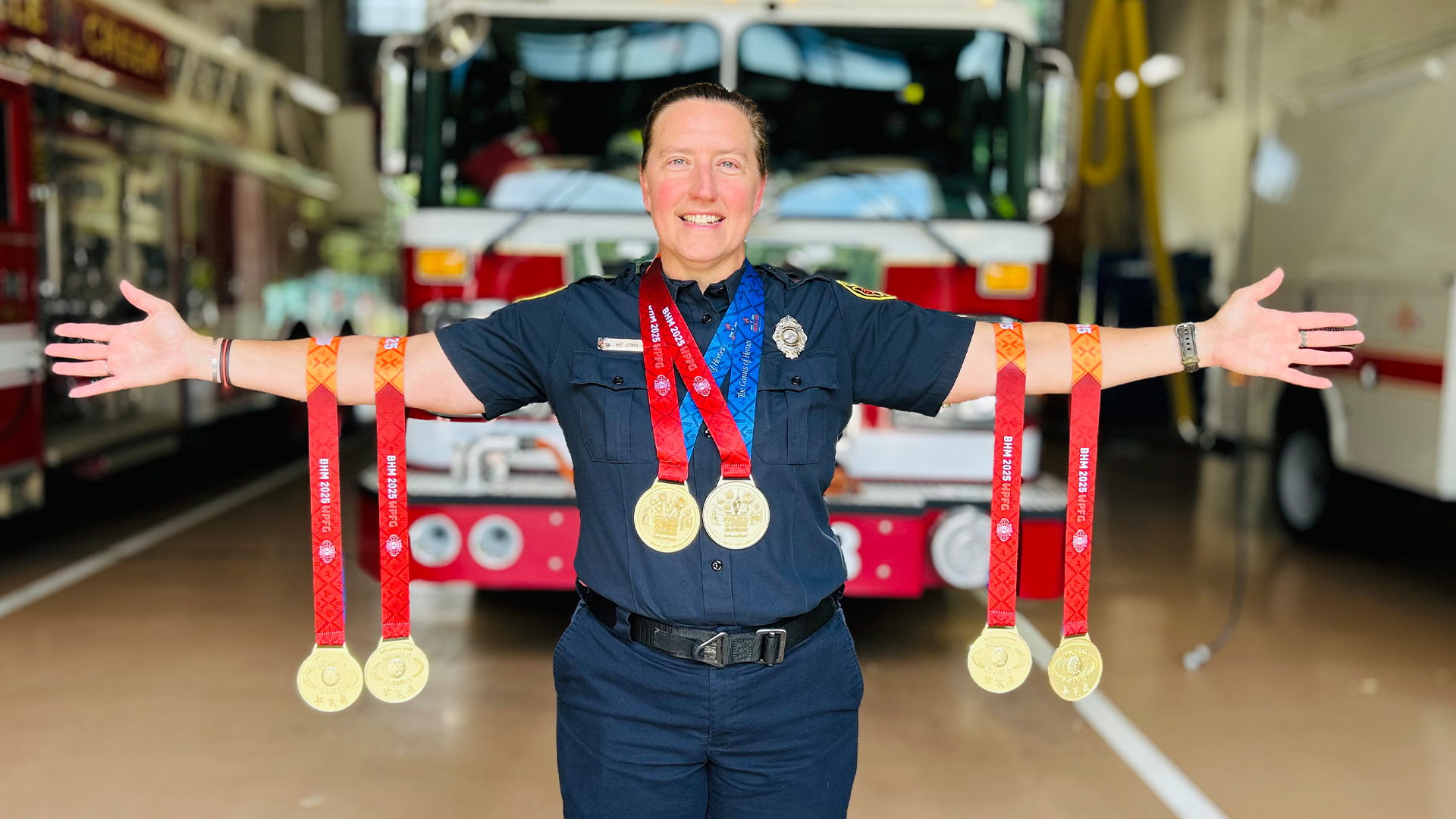 Holly Forbes Johnson displays her six gold medals at Firehouse 38, a reminder of her incredible performance on the world stage.
