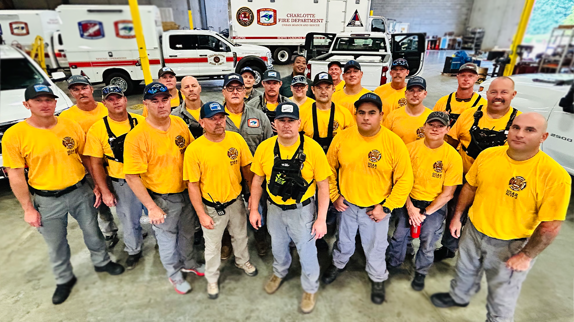 Members of Charlotte Fire’s Task Force 3 gather for a final photo before deploying to eastern North Carolina ahead of Hurricane Erin. 