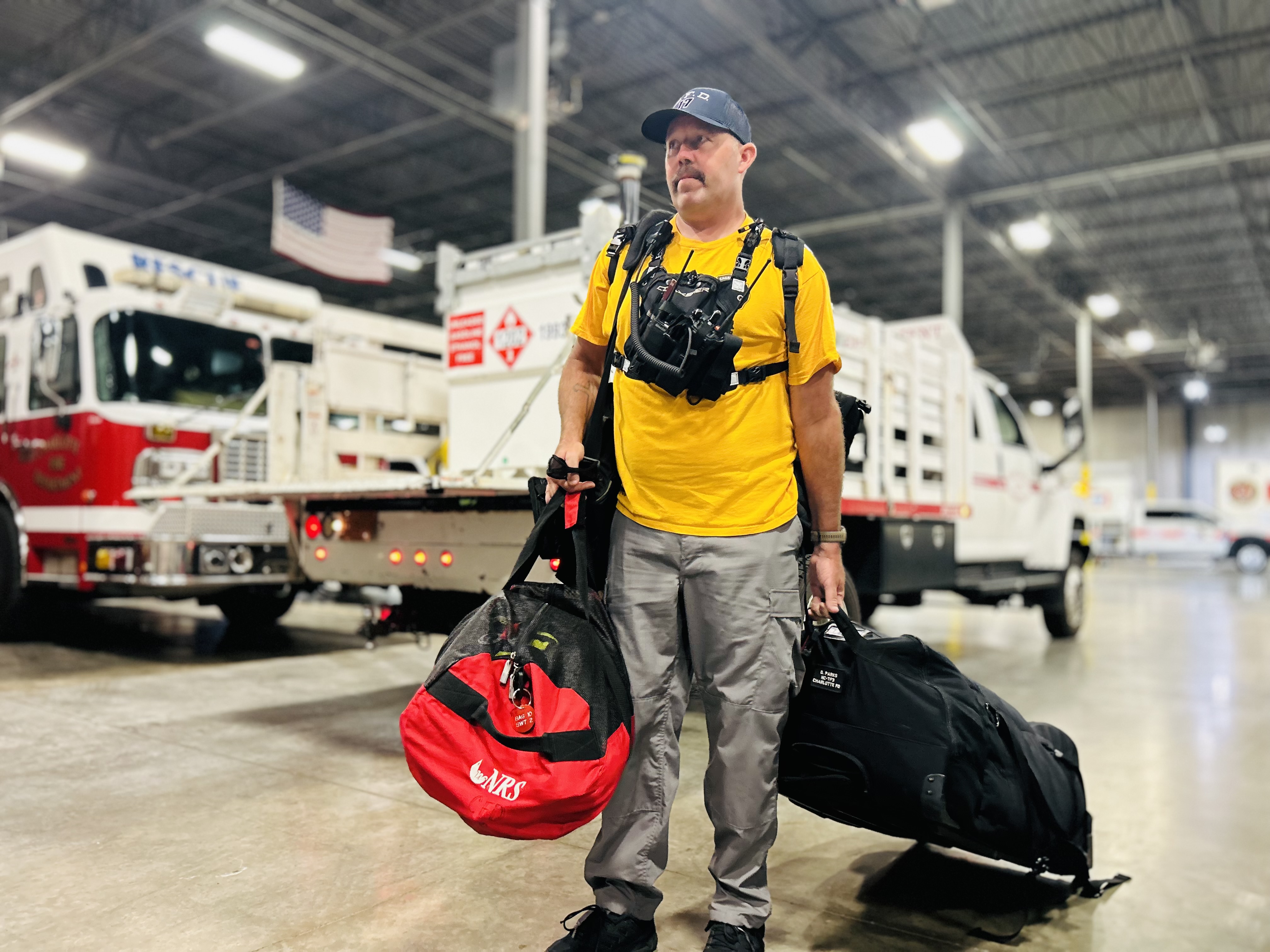 Battalion Chief Parks stands ready with deployment gear as the team prepares for possible swift water rescues and disaster response.