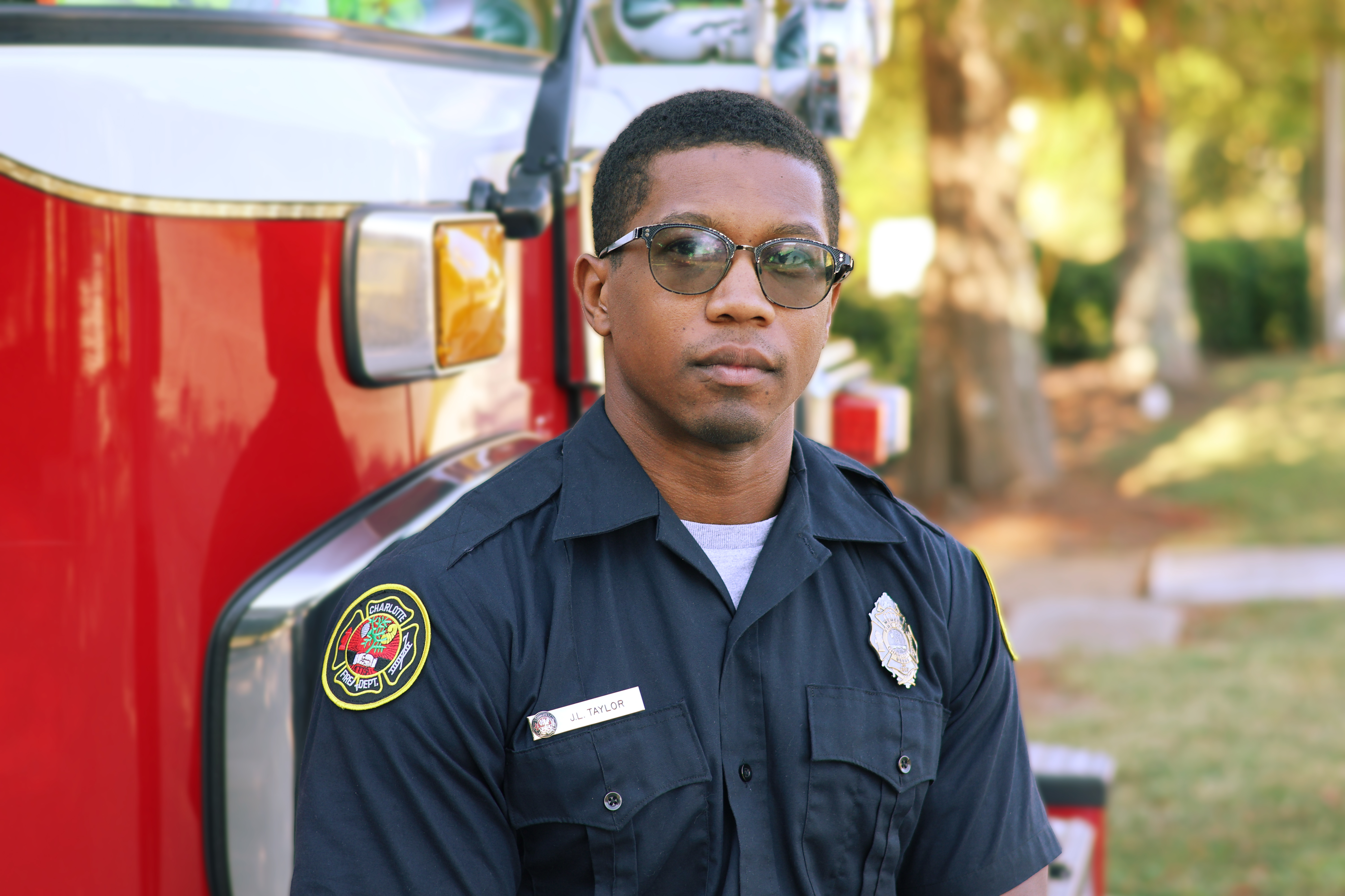 Firefighter Jerome Taylor stands with Engine 36 at his current firehouse.