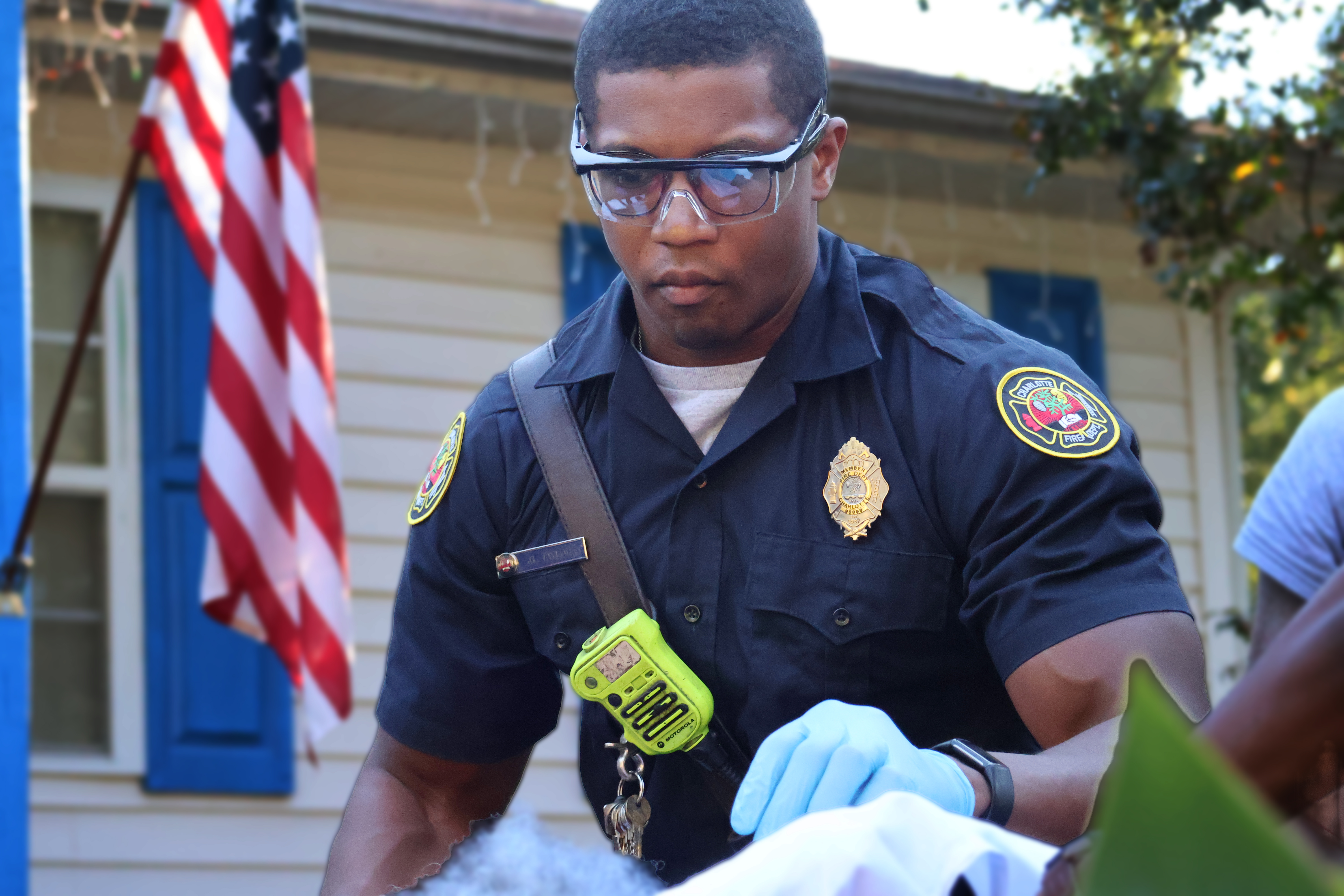 Taylor provides patient care during an unrelated response, drawing on years of health care experience before joining Charlotte Fire.