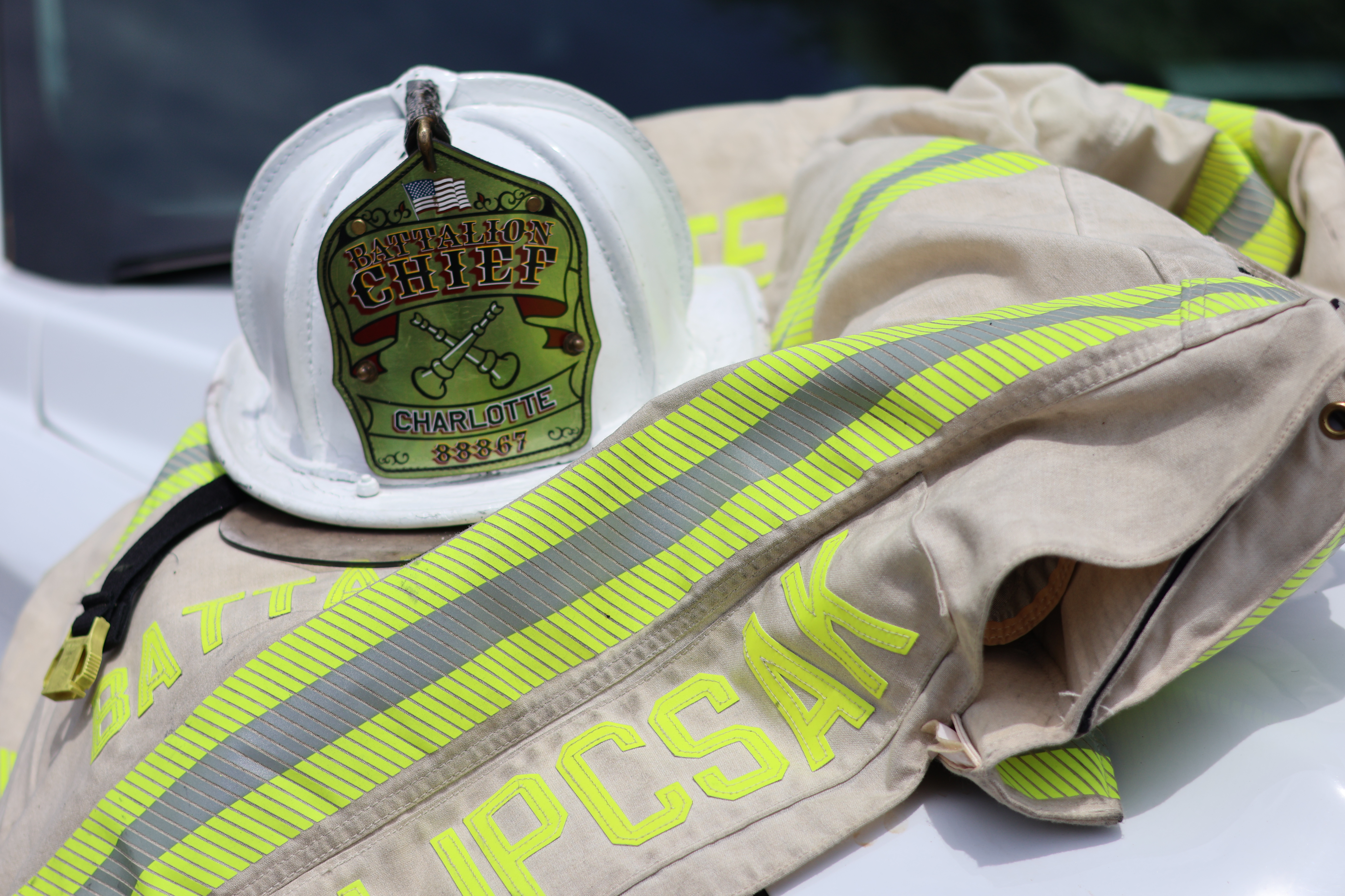 A battalion chief’s helmet and turnout gear represent a career built on preparation, leadership and the responsibility to act when someone’s life is at risk.