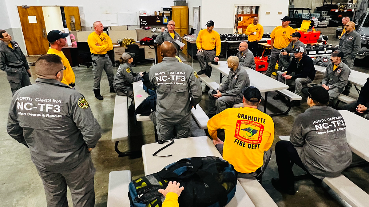 Captain Jerry Rogers and Task Force Three members discuss strategy before hitting the road for a two-week deployment in Kentucky’s flood-impacted areas