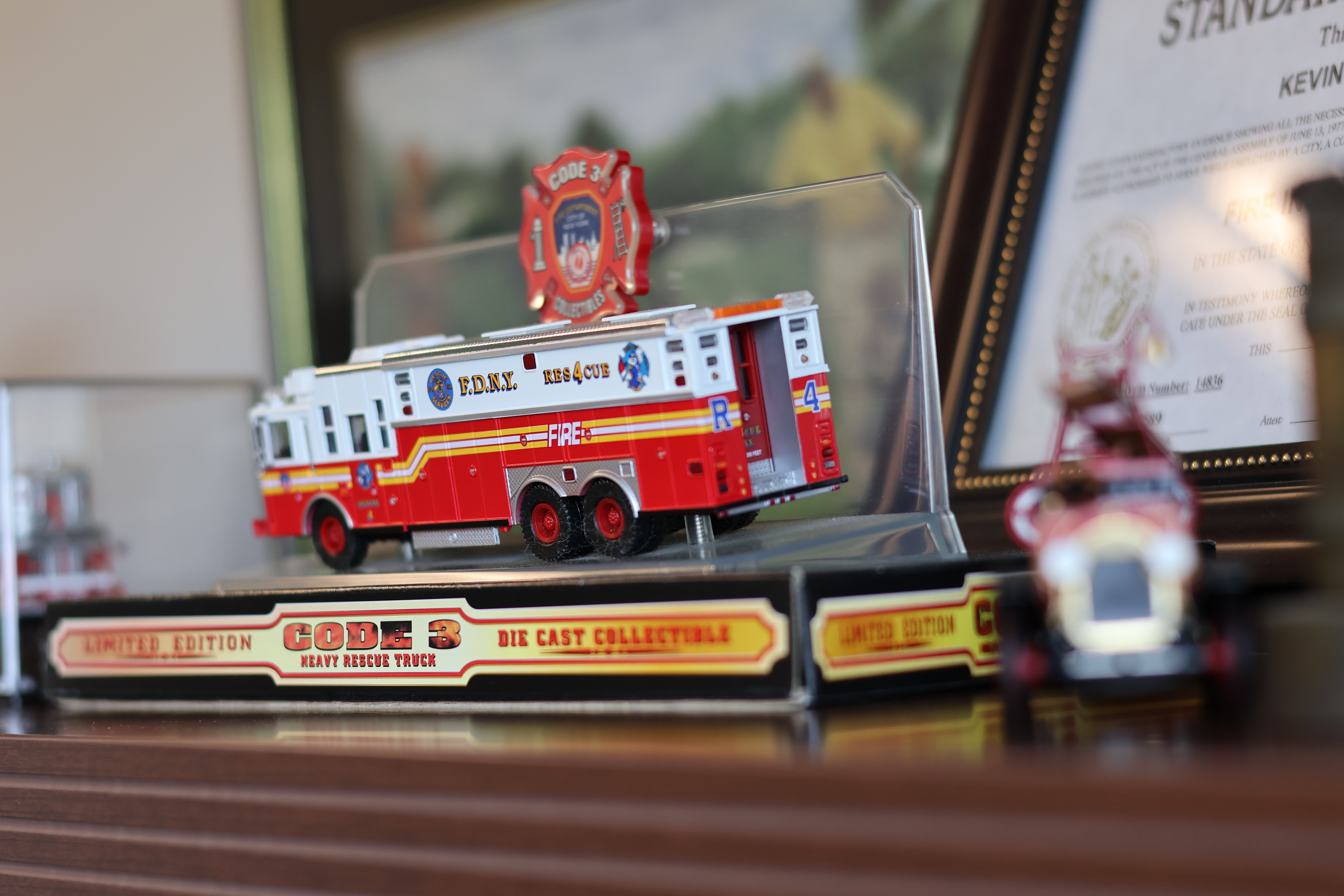 A model of an FDNY rescue company sits in Miller’s office alongside other reminders of the department he served before coming to Charlotte.