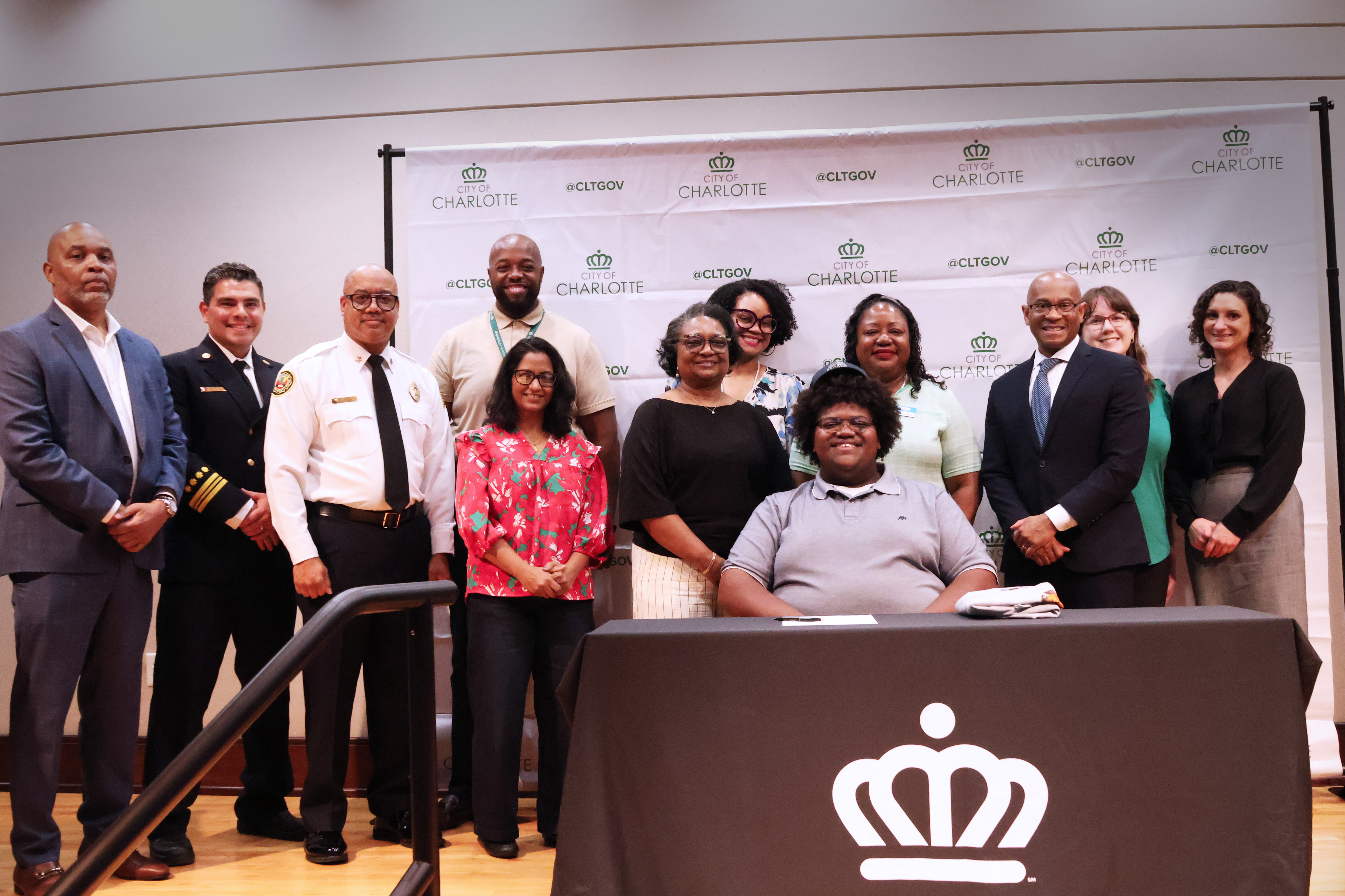 Kyle Hampton is joined by family, city leaders and Charlotte Fire members on signing day.