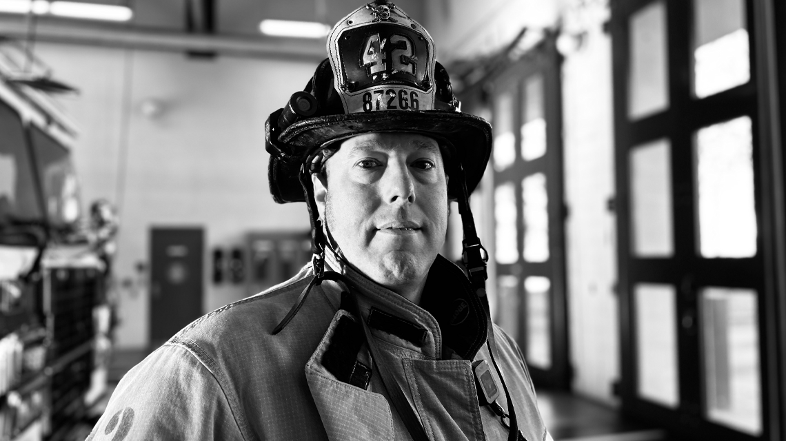 Capt. Lee Bright poses with Engine 42, the same company that stood behind him during treatment and welcomed him back after months of recovery.  