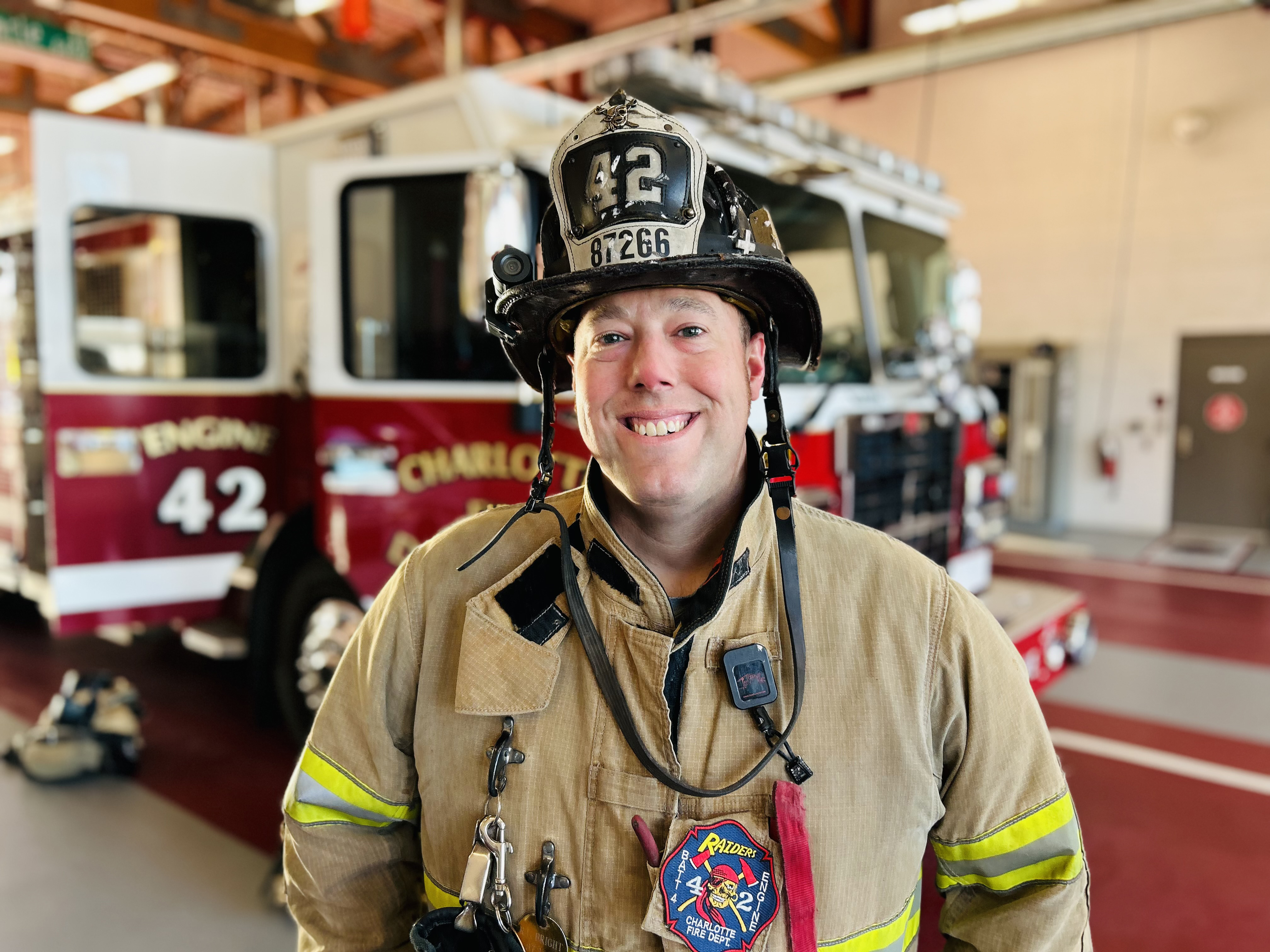 Capt. Lee Bright wears his turnout gear at Firehouse 42, a reminder that returning to the firehouse after treatment was never guaranteed and never taken for granted. 