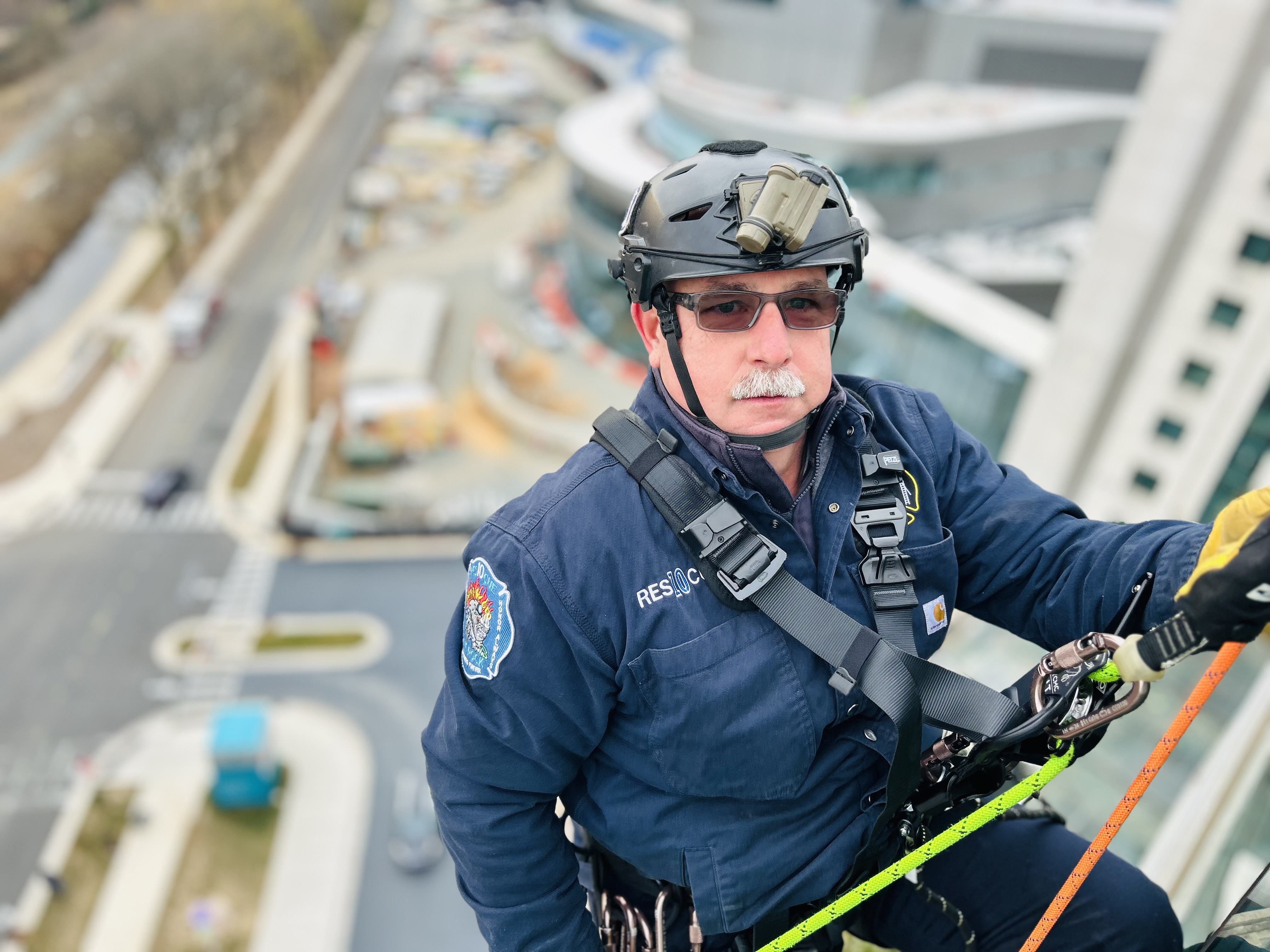 Charlotte Fire Captain Jeff Bright rappels down the side of Levine Childrens Hospital, helping bring moments of joy to young patients during a day filled with both action and compassion. 