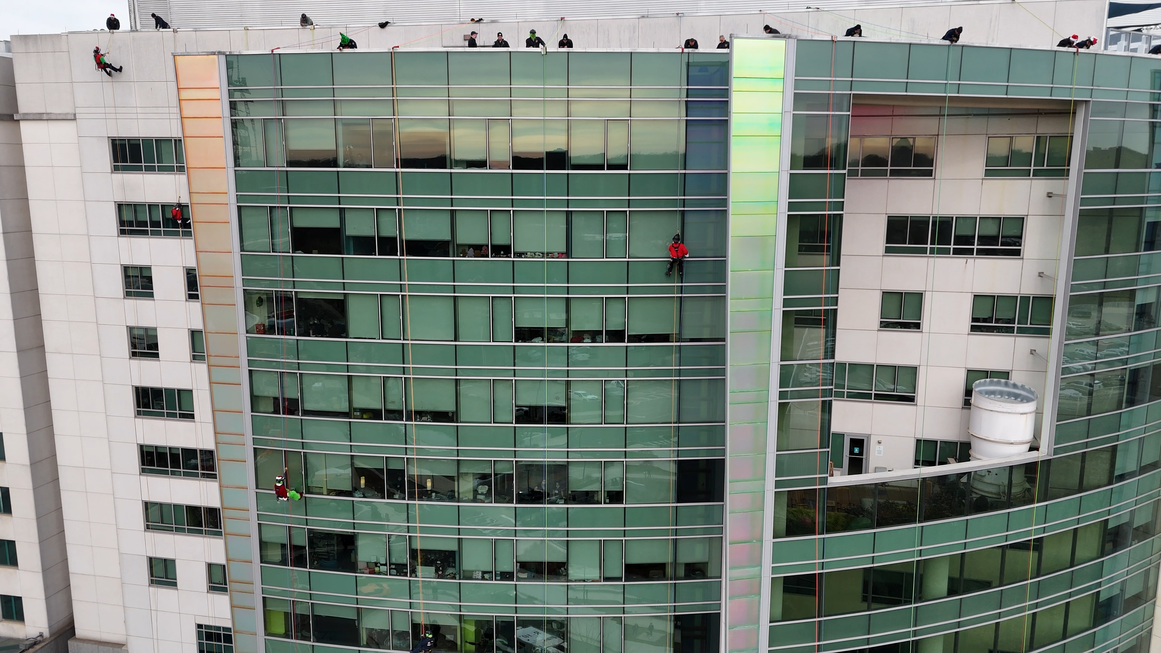 From a drone’s eye view, Charlotte Firefighters descend 12 stories to wave into hospital windows and share holiday cheer with children and families at Levine Childrens.