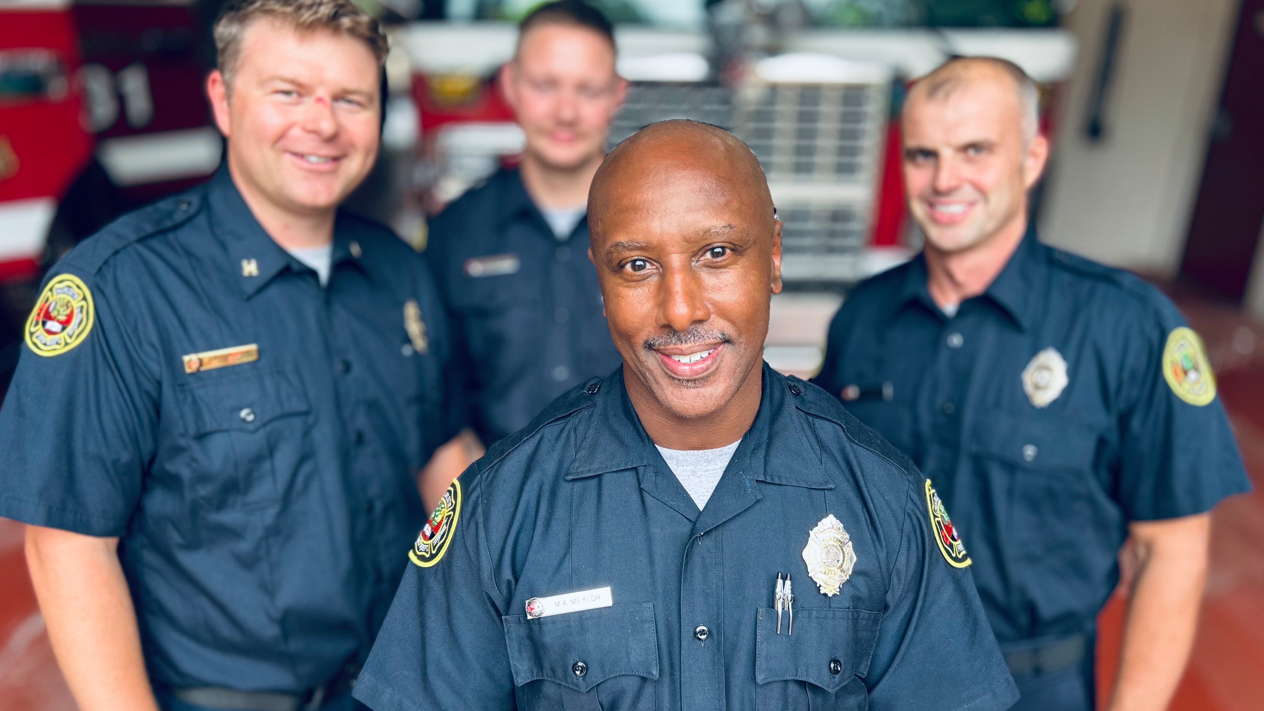Standing with fellow firefighters at Firehouse 31, Meylor values the camaraderie that carried him through his career and his health battle. 