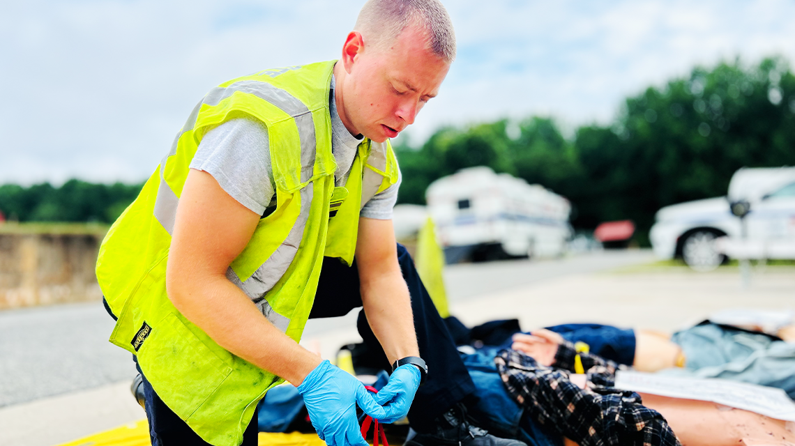Focused and deliberate, a firefighter executes rapid trauma care as part of Charlotte Fire’s large-scale training exercise aimed at preparing for the unthinkable.