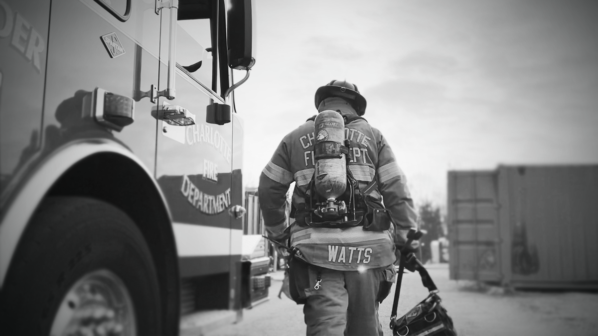 The weight of responsibility is clear as Watts guides his firefighters, preparing them for real-world emergencies.