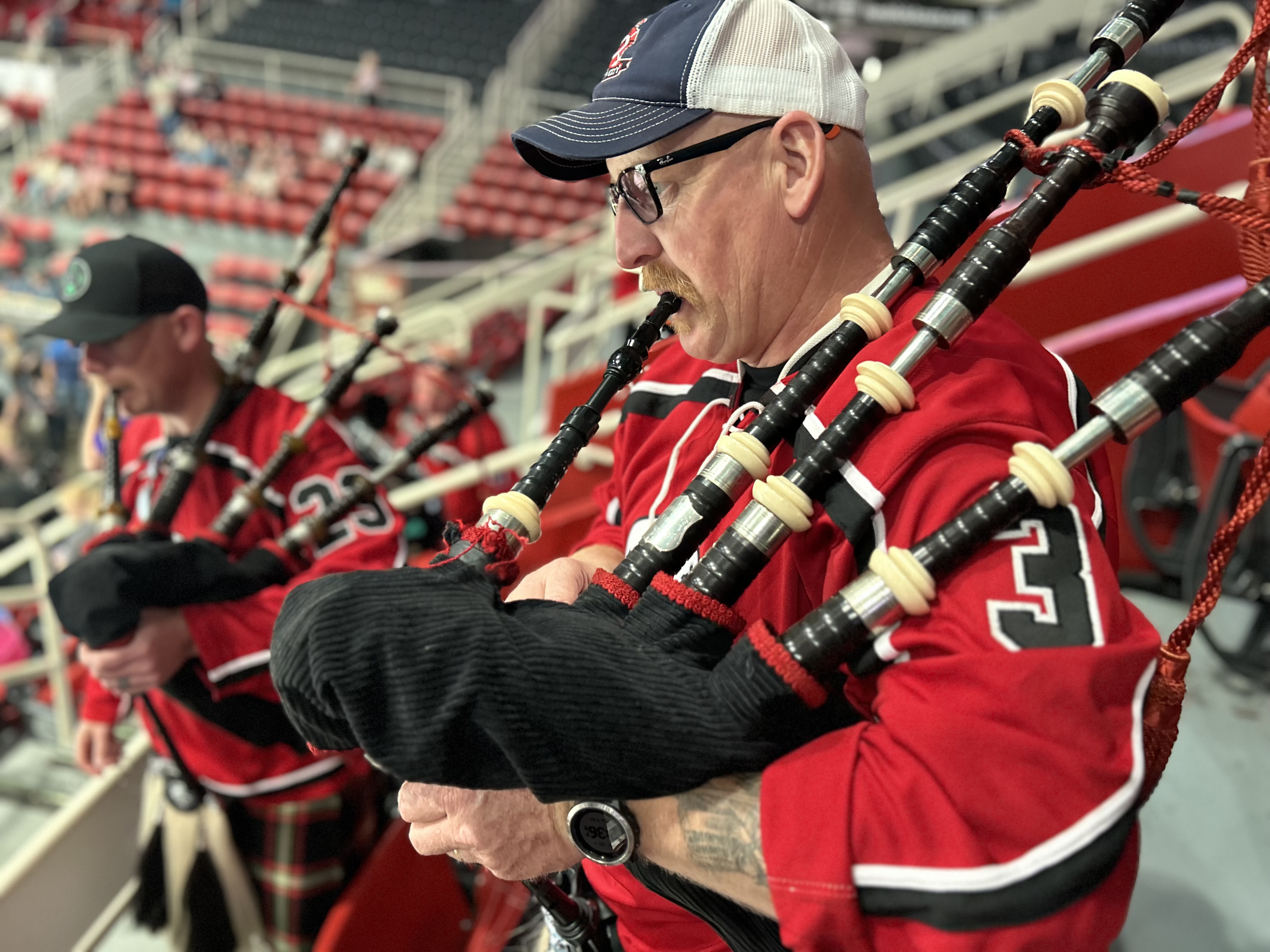 Feneis performs with Charlotte Fire Pipes and Drums during a public event in Charlotte.